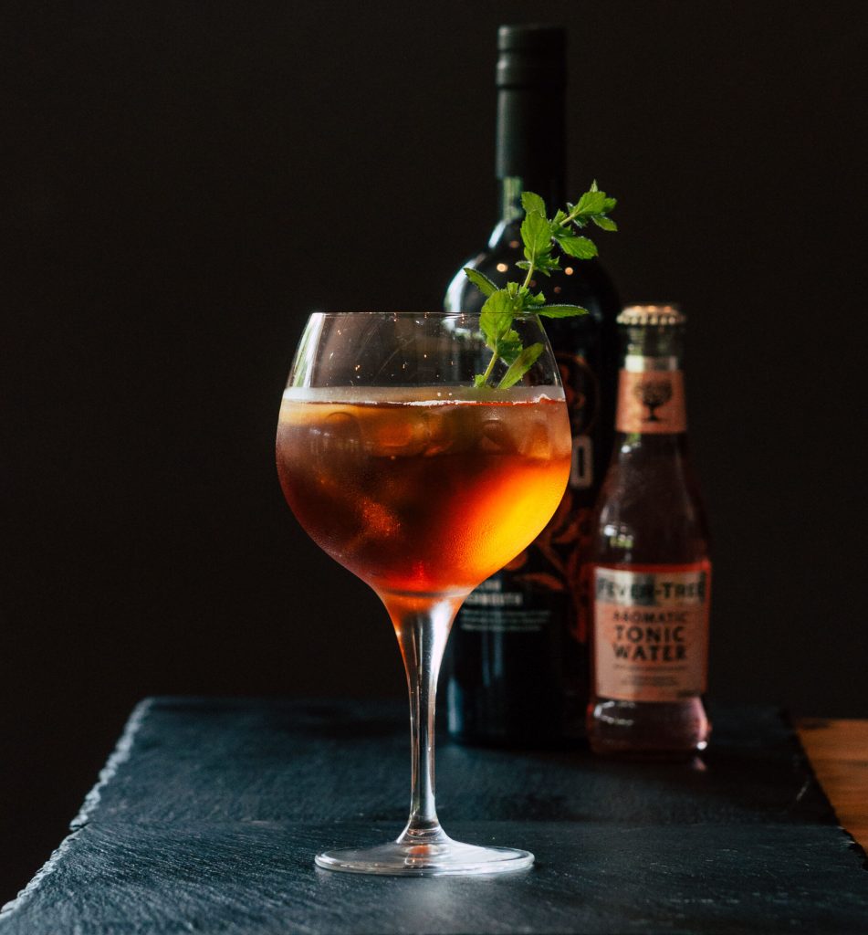 A glass of vermouth with ice