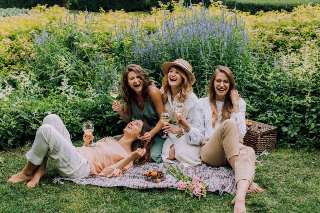 A group of ladies having a picnic at a vineyard