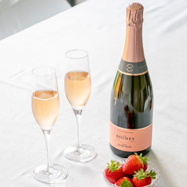 Two glasses of Cuvee rose with strawberries