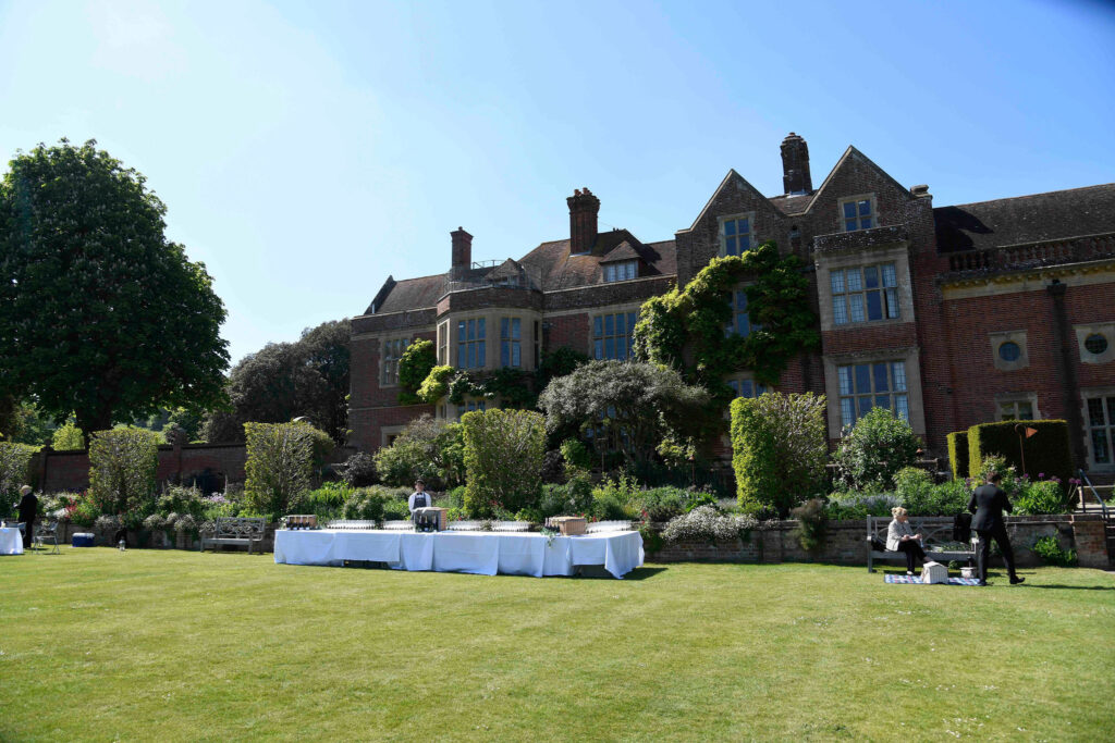 Wine reception on the lawn during summer at Glyndebourne House