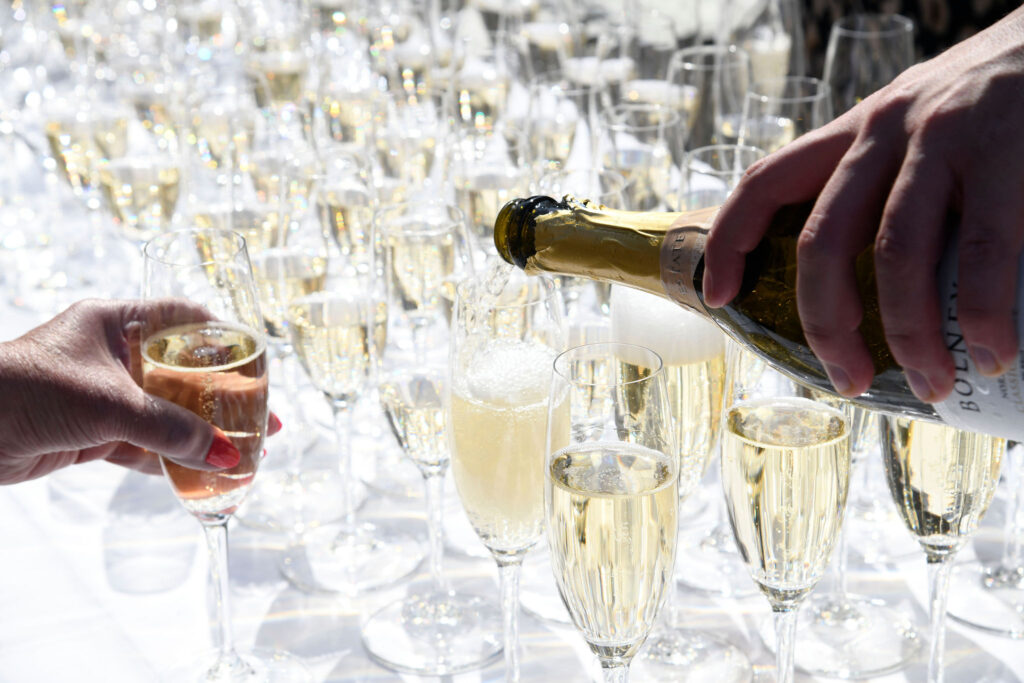Pouring and serving sparkling wine outside
