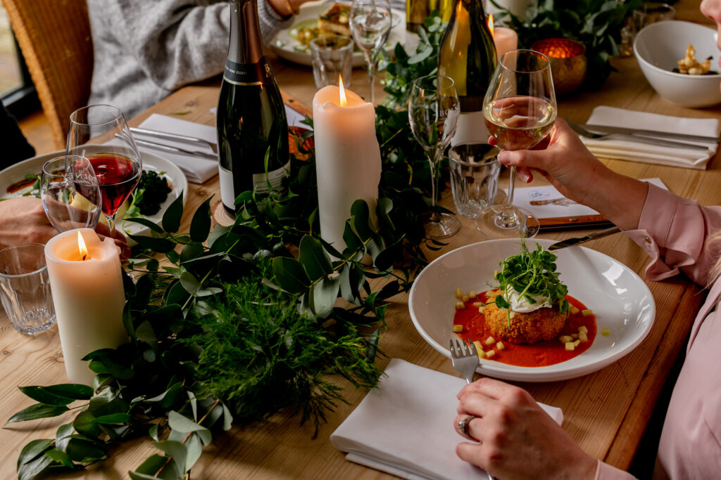 A festive wedding table with winter foliage in Bolney Wine Estate private dining room