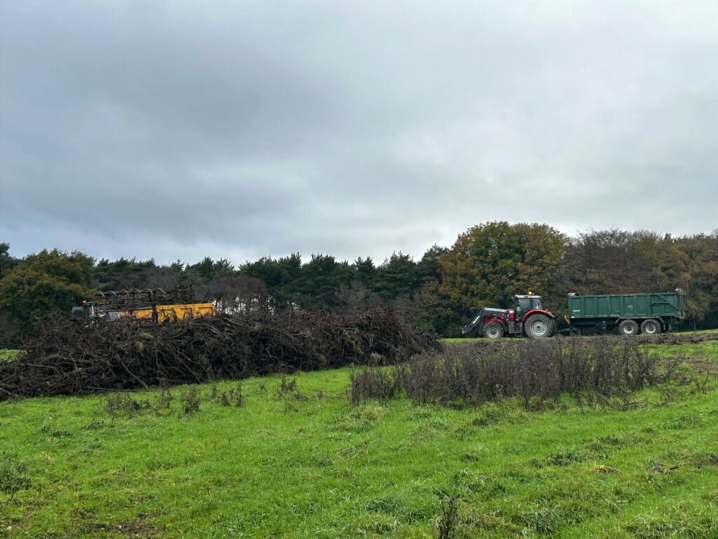 A tractor grubbing and clearing old vines at Bolney Wine Estate