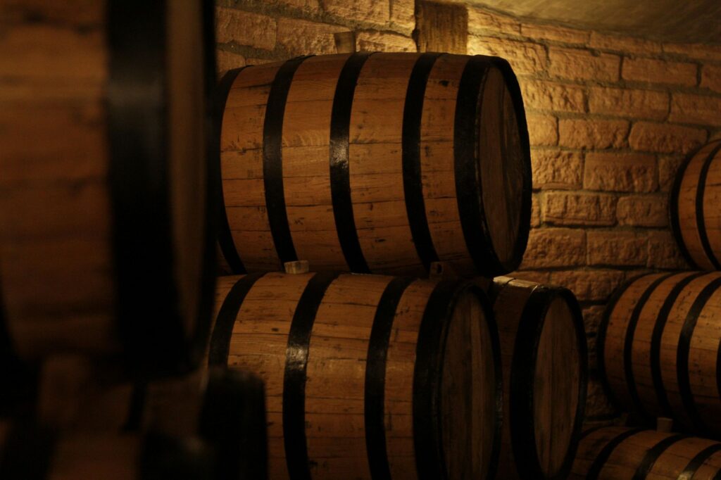 Wine barrels in a dark cellar