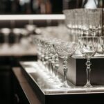Wine glasses behind a bar