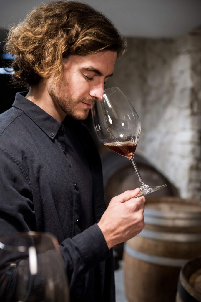 Man smelling wine at wine tasting session