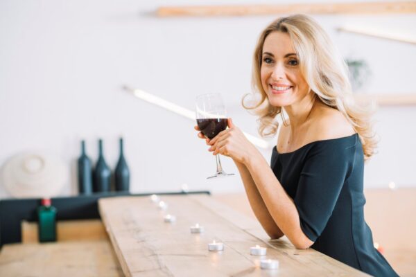 Woman holding a glass of red wine