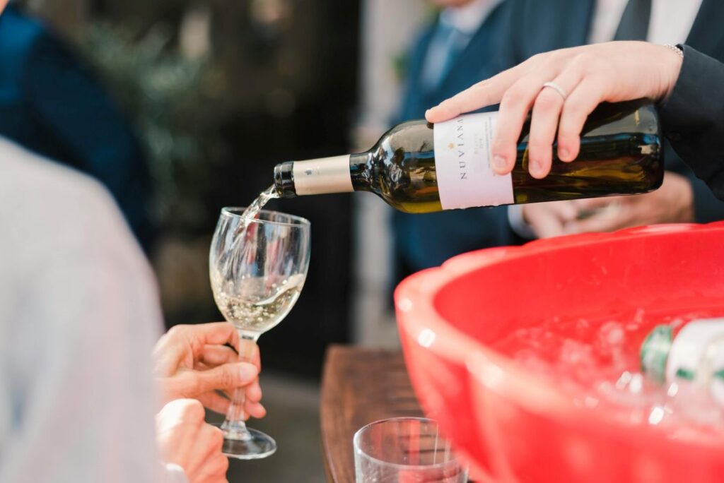 Pouring white wine into a glass