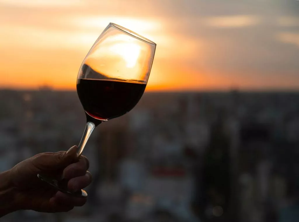 A glass of red wine in the sunset