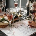 Taking notes during a wine tasting session