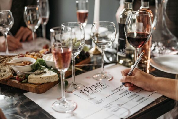 Taking notes during a wine tasting session