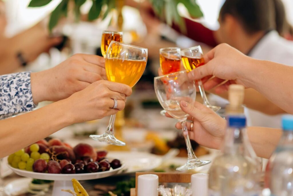 Toasting dessert wine at a dinner party