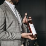 Sommelier showing a wine bottle to a group on a wine tasting session