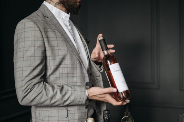 Sommelier showing a wine bottle to a group on a wine tasting session