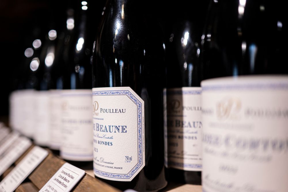 A close-up of the wine labels on red wine