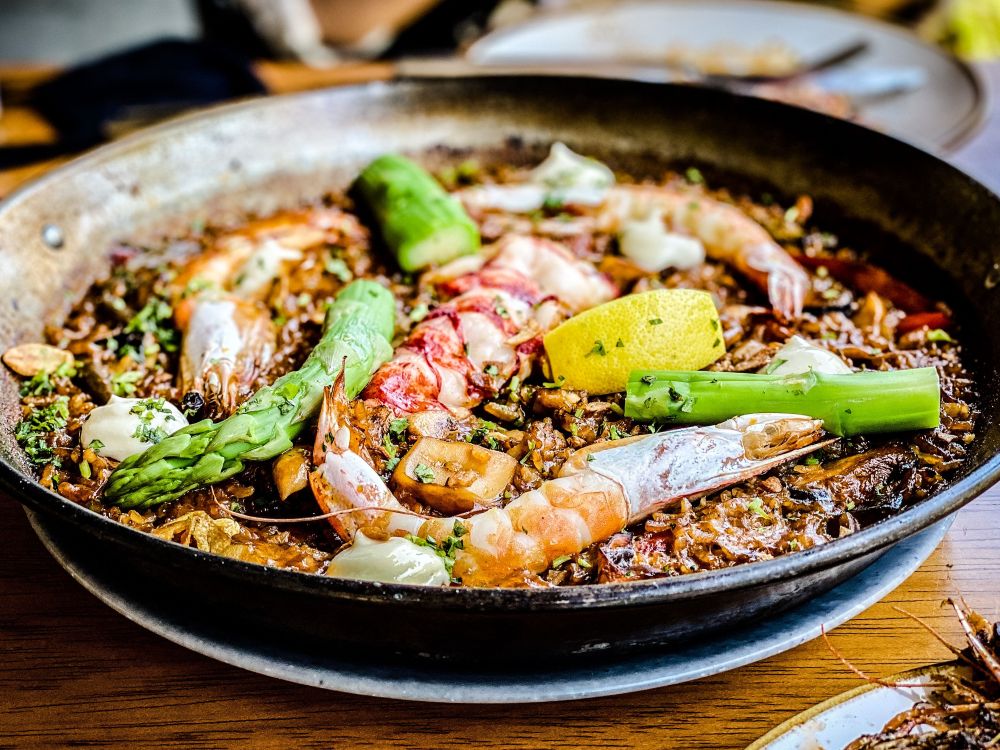 Paella dish with prawns and asparagus