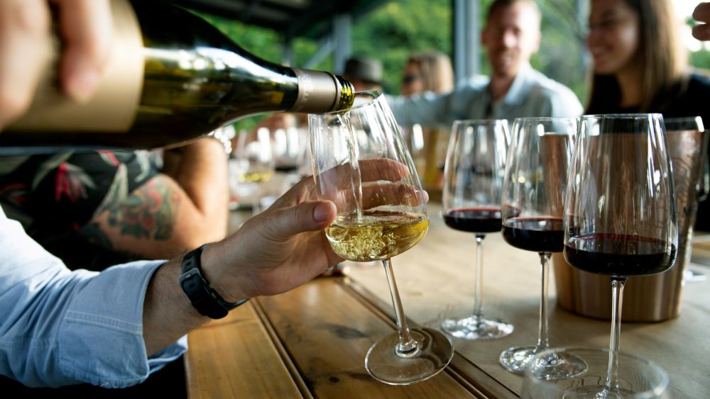 Pouring red and white wine at a corporate wine tasting event