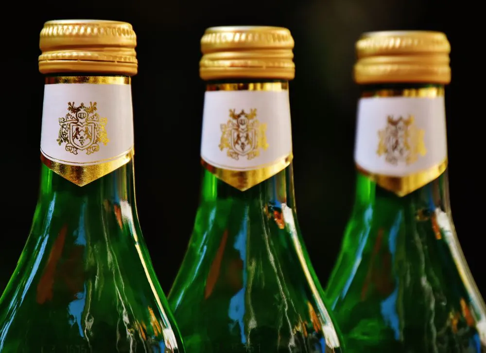 A screw cap on a bottle of white wine