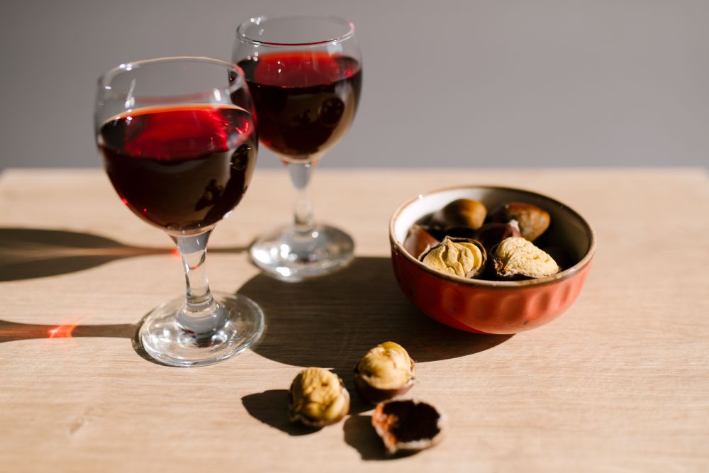 Two small glasses of port with nuts