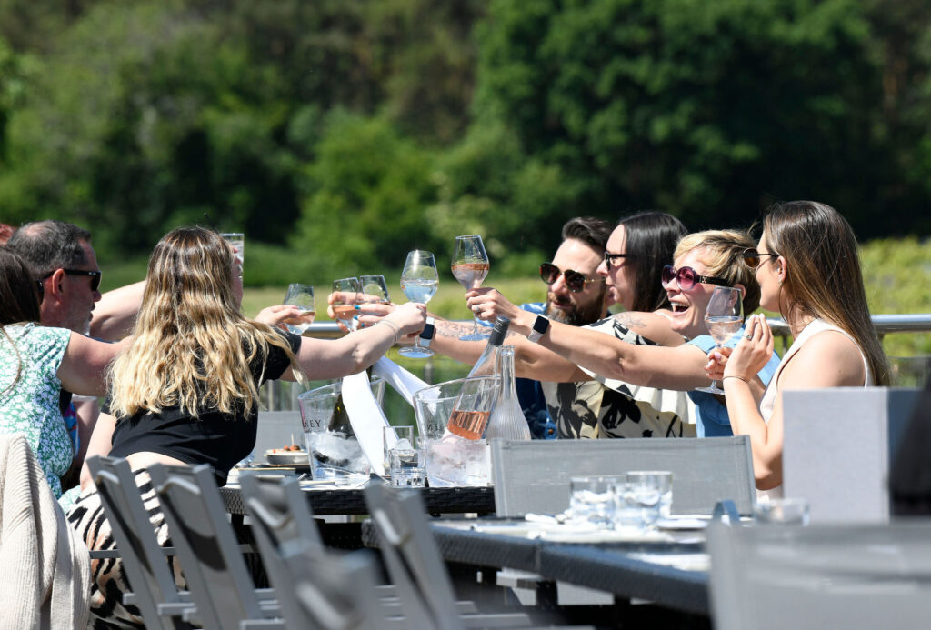 A group enjoying wine al fresco at Bolney Wine Estate