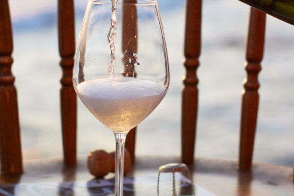 Pouring Cremant into a wine glass